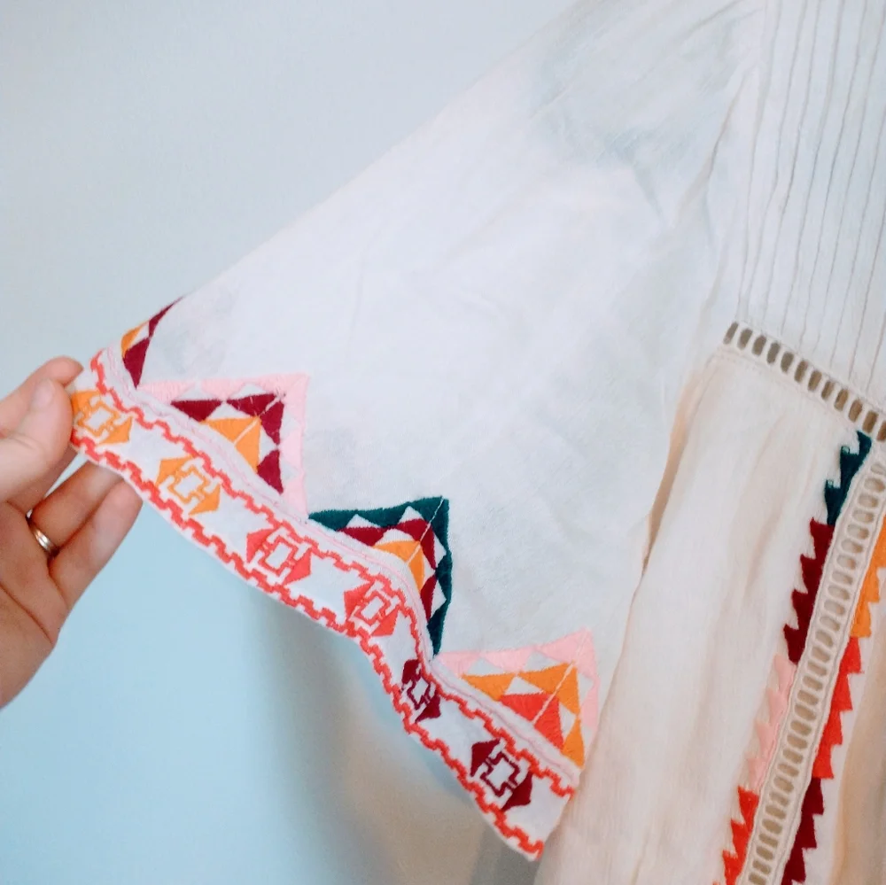 Tularosa Ingrid embroidered boho top from Revolve.  Has tassels in the front and